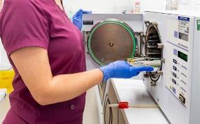 Amy Trainee Dental Nurse using specialist equipment